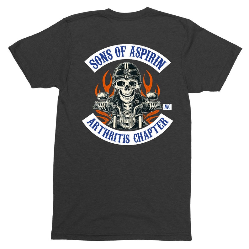May include: A dark gray t-shirt with a white patch that says "Sons of Aspirin MC Arthritis Chapter". The patch features a skeleton riding a motorcycle with flames behind it.