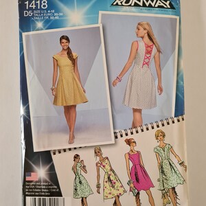 May include: Simplicity sewing pattern number 1418, inspired by Project Runway, for a dress with a criss-cross back detail. The pattern includes instructions for four different styles of dresses.