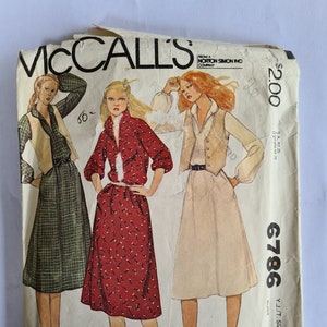 May include: Vintage McCall's sewing pattern envelope for a dress with a vest. The pattern number is 6786 and the size is 13-14. The envelope features three women wearing different versions of the dress.