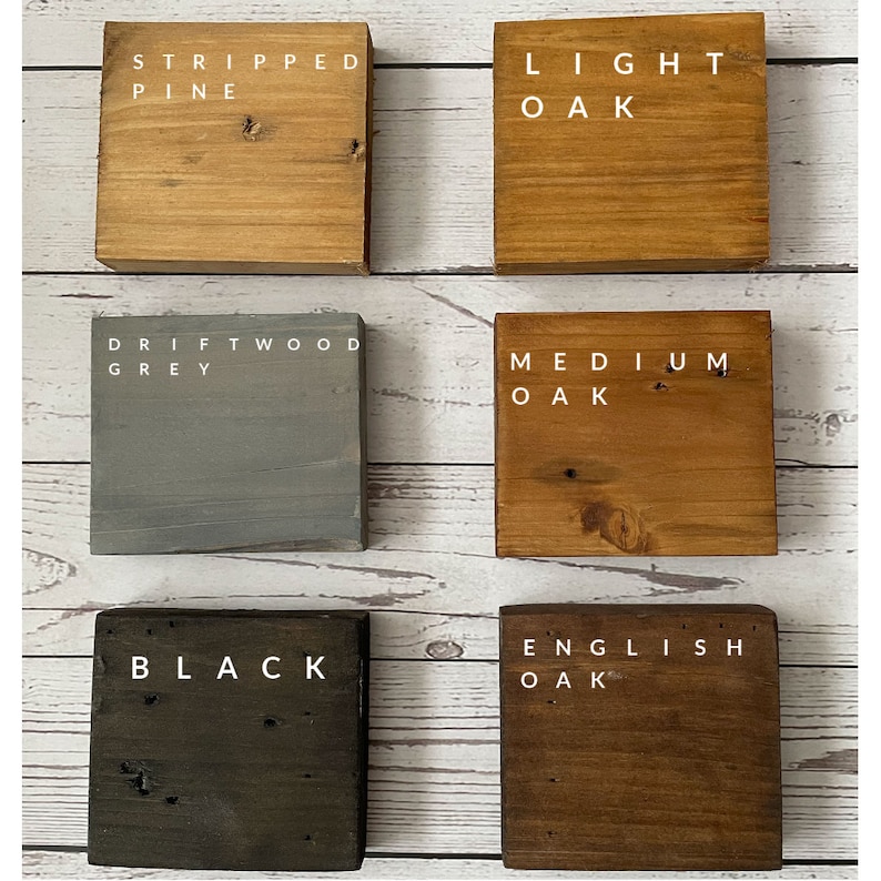 May include: Six wooden blocks, each with a different wood stain colour and a label. The colours are: Stripped Pine, Light Oak, Driftwood Grey, Medium Oak, Black, and English Oak.