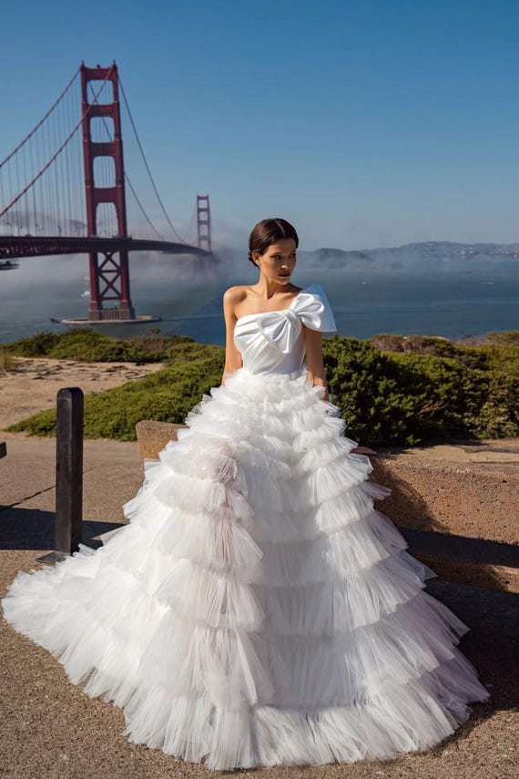 Satin wedding dress Ivory wedding dress Tulle wedding dress Classic bridal gown tutu with long train One shoulder wedding dress with bow Satin wedding dress Ivory wedding dress Tulle wedding dress Classic bridal gown tutu with long train One shoulder wedding dress with bow