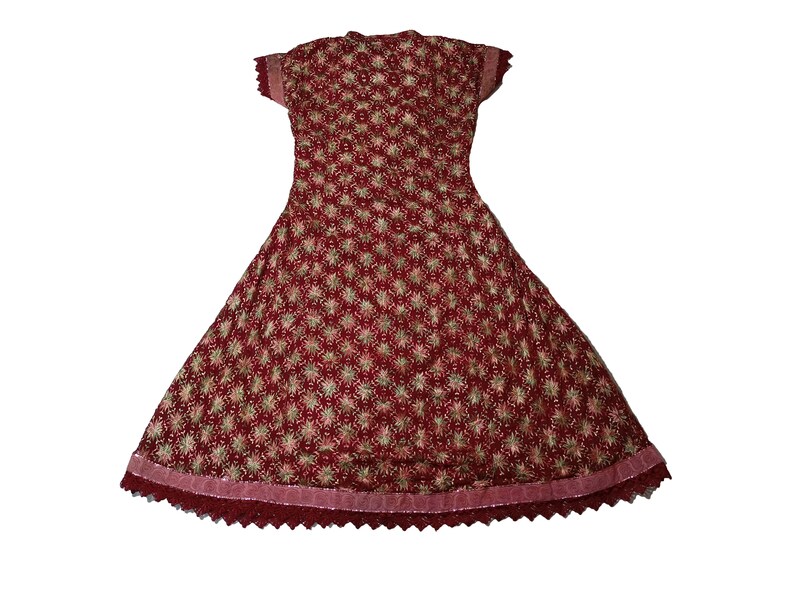 May include: A maroon dress with a floral pattern and a lace trim. The dress has short sleeves and a fitted bodice.