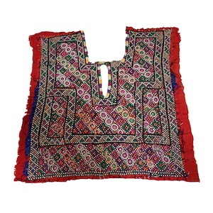 May include: A colorful embroidered fabric panel with a geometric design. The panel is red with a black border and features intricate embroidery in shades of pink, purple, green, and blue.