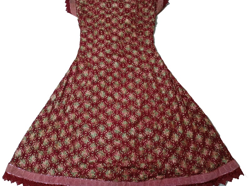 May include: A maroon-colored dress with a floral pattern and lace trim. The dress has a flared skirt and short sleeves.