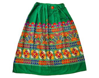 May include: A green skirt with colourful embroidered floral patterns. The skirt has a drawstring waist and a flared silhouette.