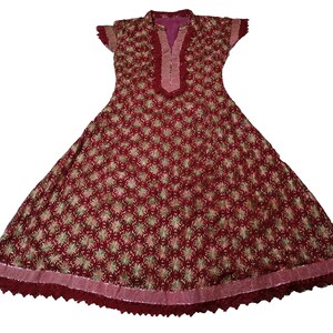 May include: A maroon dress with a floral pattern and a lace trim. The dress has a V-neckline and short sleeves.