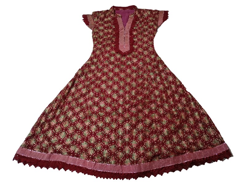 May include: A maroon dress with a floral pattern and a lace trim. The dress has a V-neckline and short sleeves.