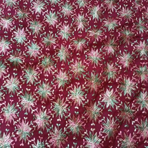 May include: Burgundy fabric with a repeating pattern of embroidered flowers in shades of pink, green, and gold.