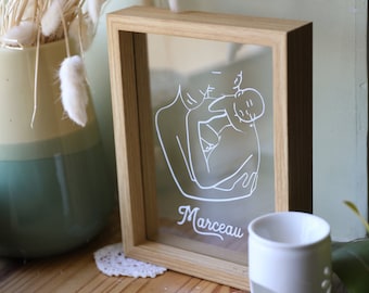 Memory of a wonderful moment at 3 with this small transparent frame to the minimum lines of parenthood, add the child's name