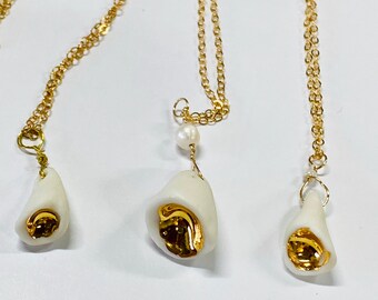 Unique white porcelain jewelry, ceramic necklace with gold, "chalice of light".