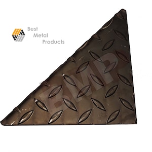 May include: A triangular piece of diamond plate metal. The metal is a dark gray color and has a textured surface. The metal is cut at a 45-degree angle.