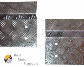 May include: Two metal corner brackets with a diamond plate pattern. The brackets have four holes each for mounting.