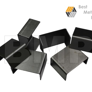 May include: A group of six black metal corner brackets. The brackets are L-shaped and have a smooth, matte finish.