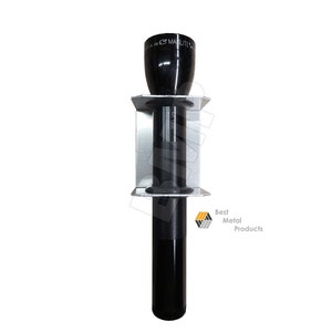 May include: A black Maglite flashlight in a silver metal holder. The flashlight is cylindrical with a textured grip and a black head. The holder is mounted on a white background. The text "MAGLITE" is visible on the flashlight head.