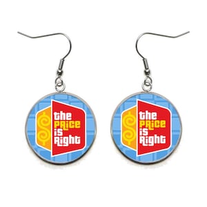 May include: A pair of silver earrings with a round blue and yellow design featuring the "The Price is Right" logo. The logo is red and yellow with a dollar sign.