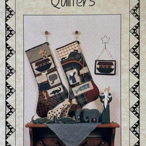May include: A pattern sheet titled Kansas Troubles Quilters Noah Stockings #9535 featuring two fabric stockings with Noah's Ark motifs, a small hanging ark ornament, and wooden animal figurines including giraffes, elephants, and a bearded figure.