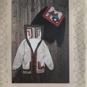 May include: A sewing pattern envelope titled SWEATJACKET from A Quilter's Wardrobe, featuring a light gray zip-up hoodie with floral and geometric patchwork accents and a black pullover with a square patchwork yoke on the front.