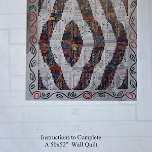 May include: A quilt pattern titled Pond Ripples Log Cabin Rectangular Clamshell, featuring a central design of interlocking colorful and black-and-white geometric shapes, surrounded by a border of embroidered leaves and vines, measuring 50x52 inches.