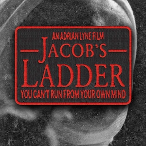 May include: A rectangular embroidered patch with a black background and a red border. The text reads AN ADRIAN LYNE FILM, JACOB'S LADDER, and YOU CAN'T RUN FROM YOUR OWN MIND in red stitching. The patch is centered over a dark, textured grayscale image.