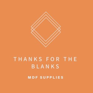 May include: Orange background with a white geometric design of overlapping squares. The text "THANKS FOR THE BLANKS MDF SUPPLIES" is below the design.