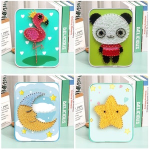 May include: Four string art kits with different designs: a flamingo, a panda, a crescent moon, and a star. Each kit comes with a wooden frame, colorful yarn, and nails.