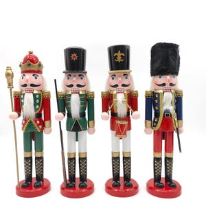 May include: Four wooden nutcrackers in festive outfits. Each figure has a unique design, including red, green, and blue jackets, black boots, and various hats. They stand on red bases, with gold and white accents, perfect for holiday decor.
