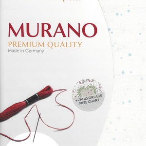May include: White Aida cloth with a blue dot pattern. The cloth is precut and measures 19 inches by 27 inches. The package includes a free chart for cross-stitch embroidery. The text "MURANO PREMIUM QUALITY Made in Germany" is printed on the package.