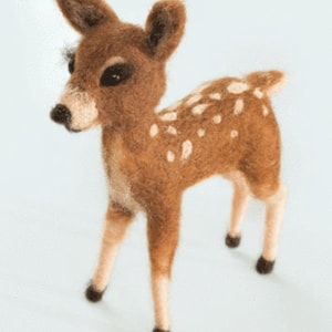 May include: A small, brown and white needle felted deer figurine. The deer has a long, slender neck and a small, pointed head. It has large, dark eyes and a small, black nose. The deer is standing on all four legs and has a long, bushy tail.