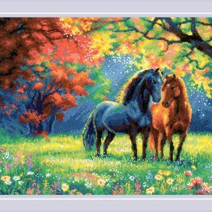 May include: A cross-stitch embroidery pattern depicting two horses, one black and one brown, standing in a vibrant meadow filled with colorful wildflowers. The background features a lush forest with autumn-toned foliage in shades of red and yellow.