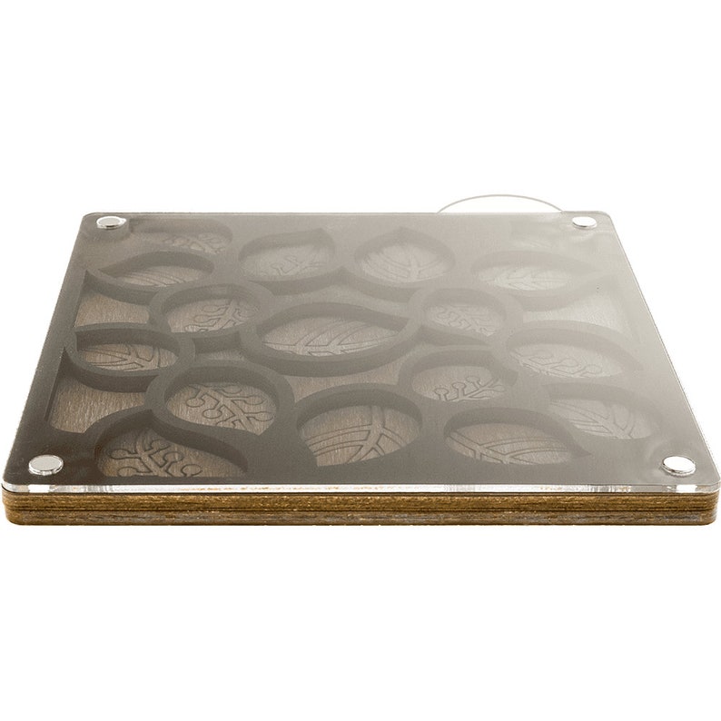 May include: A wooden tray with a clear acrylic top. The tray has a design of leaves cut out of the wood. The tray is made of multiple layers of wood.