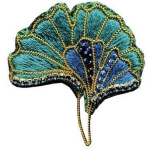 May include: A green and blue embroidered ginkgo leaf brooch with gold accents. The leaf is detailed with a fan-like pattern and sparkling beads.