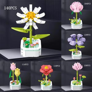 May include: Six different flower building sets with varying piece counts. Each set features a different flower type, including a daisy, a rose, a tulip, a lotus, and two other flowers. The flowers are all in different colors and are displayed on a white background.