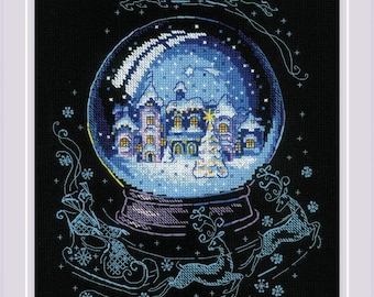 May include: Cross-stitch design of a snow globe with a winter village scene. The globe features a town with snow-covered buildings, a Christmas tree, and falling snow. Reindeer and a sleigh are depicted around the globe, all against a black background.