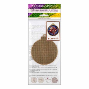 May include: A brown embroidery hoop with a beige background and a colourful Christmas ornament design. The hoop is labelled "FLW-010" and is part of a craft kit for needlepoint.