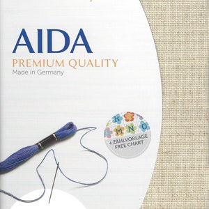 May include: A Zweigart precut Aida fabric package in premium quality, made in Germany. The packaging features the text AIDA, PREMIUM QUALITY, and includes a free chart. It measures 48 x 53 cm or 19 x 21 inches, with 6.4 stitches per cm or 16 ct.