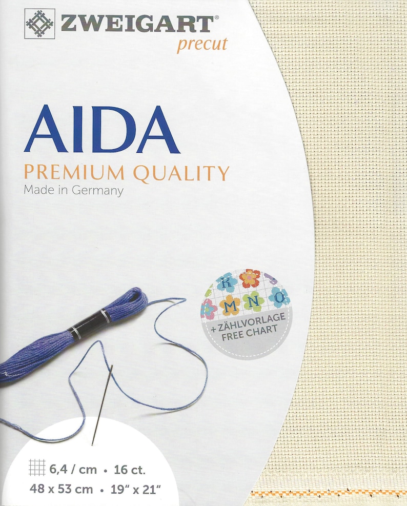 May include: Zweigart precut Aida premium quality fabric in off-white with a visible grid texture. The packaging features the text AIDA, PREMIUM QUALITY, Made in Germany, and 48 x 53 cm 19 x 21 inches. Includes a skein of blue embroidery floss.