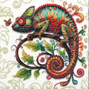 May include: A colorful beaded chameleon perched on a branch with green leaves. The chameleon's body is a mix of red, orange, yellow, green, and blue beads. The background is white with a floral pattern.