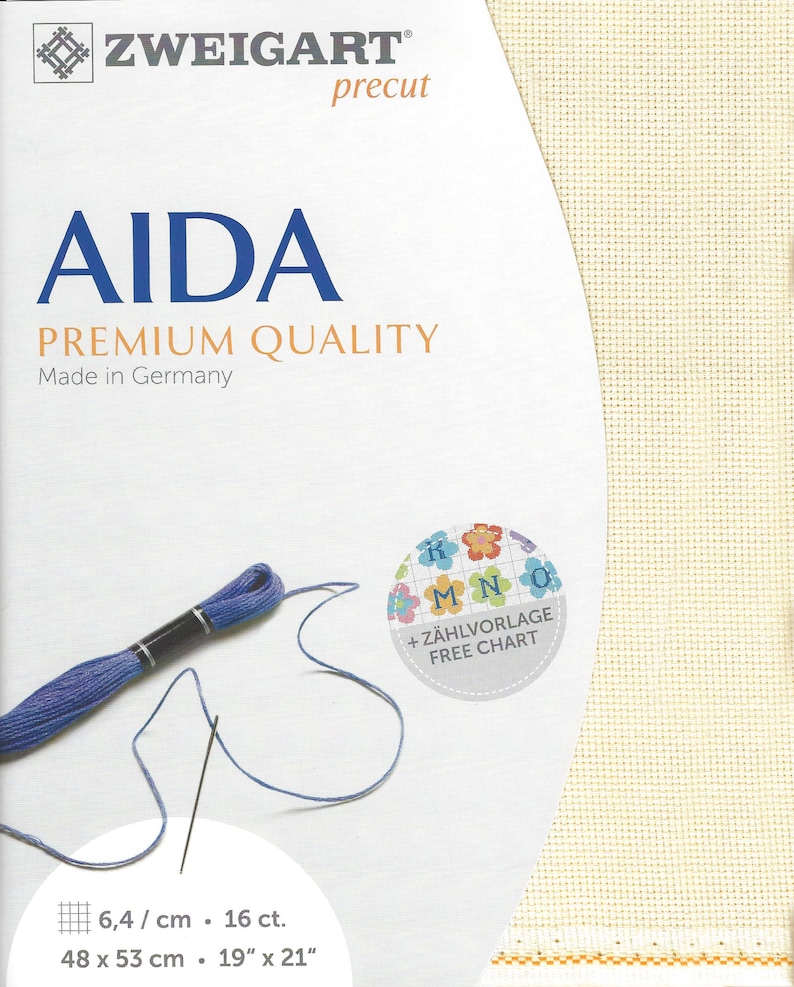 May include: Zweigart precut Aida fabric in cream, featuring a premium quality label, Made in Germany text, and a free chart sticker. Includes a length of blue embroidery floss with a needle, and dimensions of 48 x 53 cm or 19 x 21 inches.