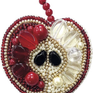 May include: A beaded apple ornament with red, white, and gold beads. The apple has a red stem and a black eye design.