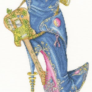 May include: Cross-stitch design of a high-heeled shoe with a guitar-shaped heel. The shoe is primarily blue with gold and white accents. The heel is pink, and the guitar is tan and green. A pink ribbon is also present.