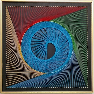 May include: A square string art piece featuring a central blue spiral pattern surrounded by geometric lines in red, green, gold, and blue. The design is created with thin threads wrapped around small gold nails on a black board in a gold frame.