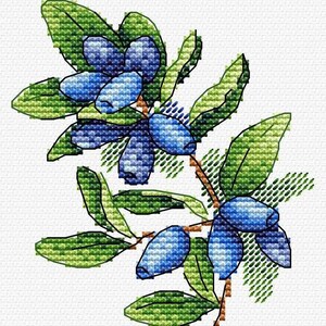 May include: Cross-stitch design of a branch with blue berries and green leaves. The berries are a gradient of blue hues, and the leaves are a mix of light and dark green. The design is on a white background, showcasing the detailed needlework.