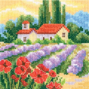 May include: A cross-stitch pattern of a quaint house with a red tile roof, surrounded by lavender fields and red poppies. The house is white with yellow accents and has a window on the side. The background is a bright blue sky with fluffy white clouds.