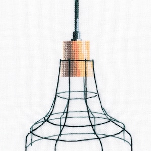 May include: A black wire cage pendant light with a brown and orange light bulb.