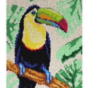 May include: A toucan with a colorful beak perched on a branch. The toucan is black with a yellow breast and a red patch on its beak. The background is a green and white fuzzy texture.