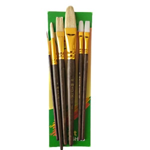 May include: Set of six paint brushes with brown wooden handles and gold ferrules. The brushes are arranged in a green and yellow package with the word "KOLOS" printed on the package.