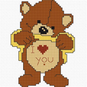 May include: A brown teddy bear holding a yellow ribbon with a red heart and the words "I love you" on its chest.