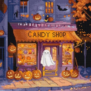 May include: A cross-stitch image of a candy shop decorated for Halloween. The shop has a sign that reads "CANDY SHOP" and is adorned with jack-o'-lanterns and a ghost. The shop's window displays various candies and pumpkins.