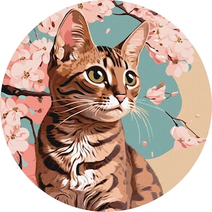 May include: A brown tabby cat with green eyes sits in front of a pink and white cherry blossom tree. The cat is looking to the right of the image.