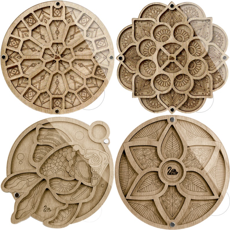 May include: Four wooden circular puzzle boxes with intricate laser-cut designs. The designs include a geometric pattern, a mandala, a flower, and a fish.